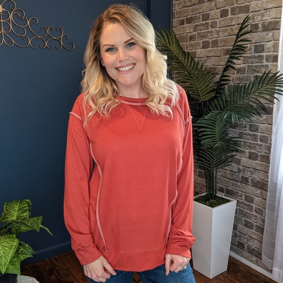 Burnt orange reversed stitching long sleeve top.. Sizes small, medium, 2X, 3x - Picture 1 of 2